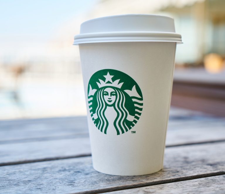Closed White and Green Starbucks Disposable Cup
